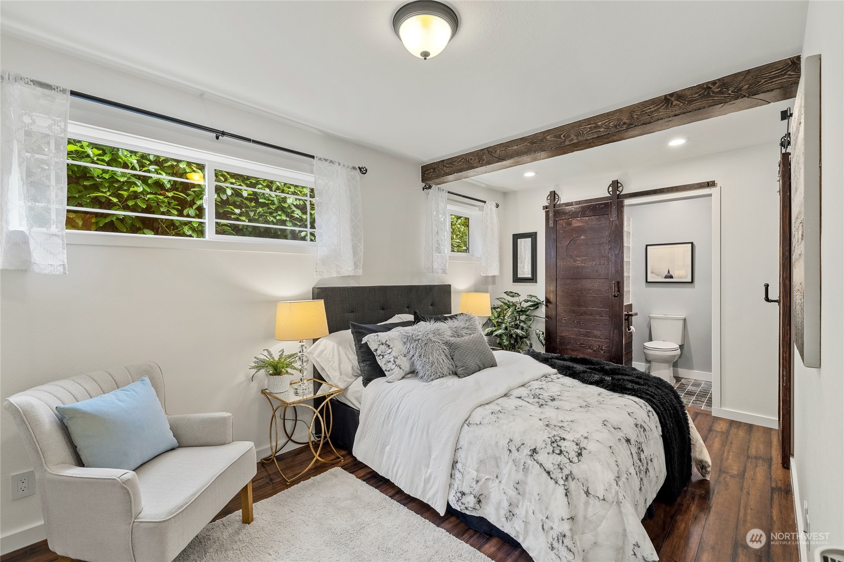 9734 31st Avenue Southwest Seattle, WA 98126 - Photo 15 of 29 a bedroom with a bed and window
