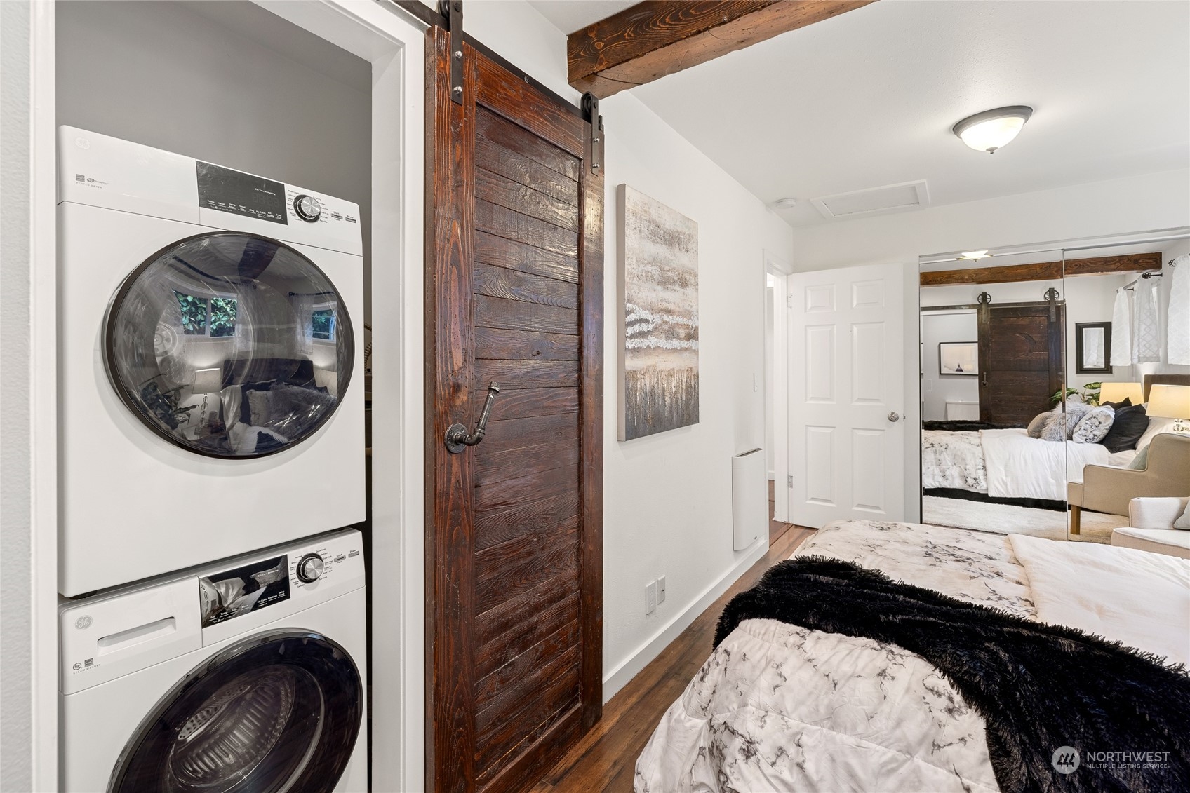9734 31st Avenue Southwest Seattle, WA 98126 - Photo 17 of 29 a bedroom with a bed and mirror