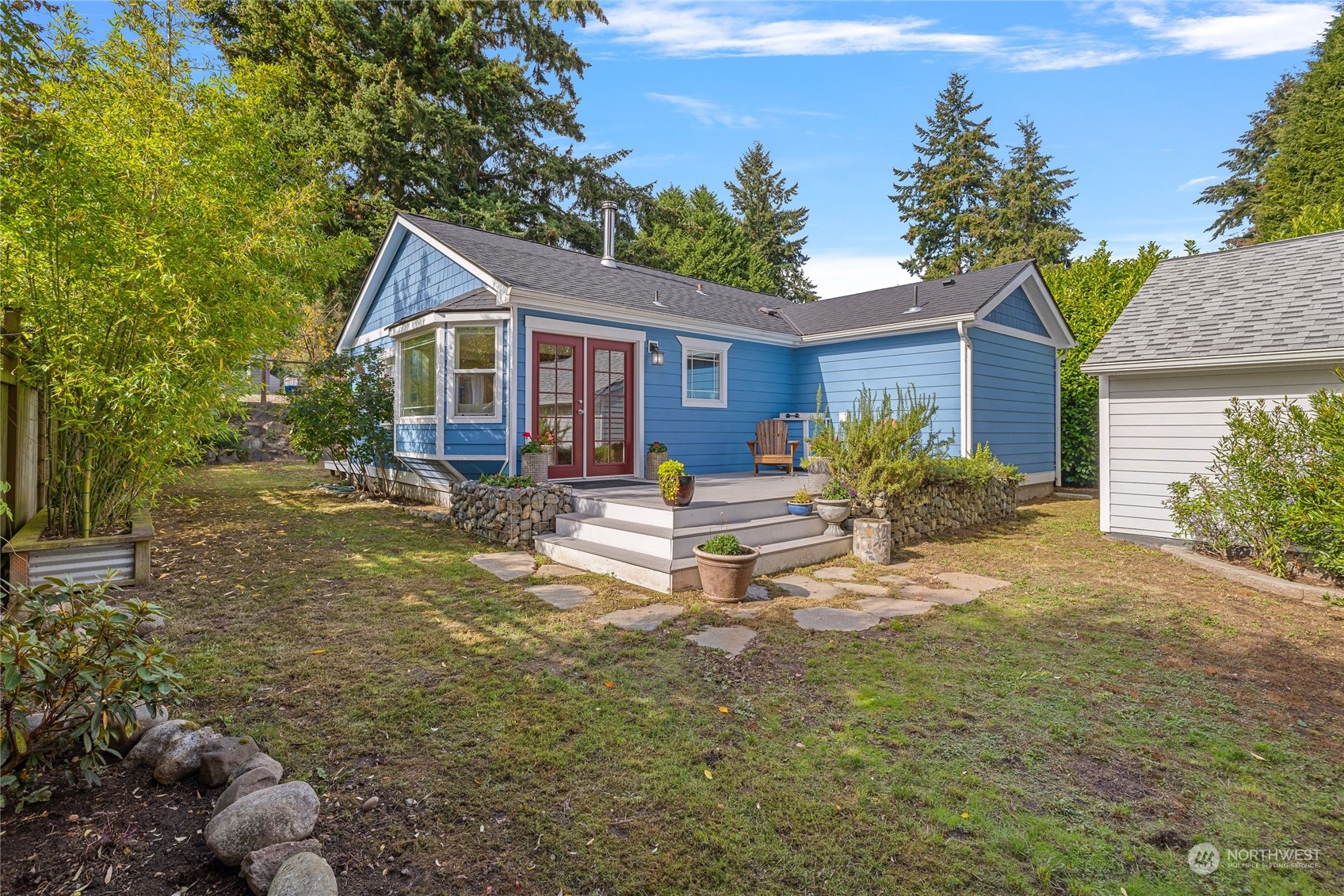 9734 31st Avenue Southwest Seattle, WA 98126 - Photo 25 of 29 a view of a house with backyard and sitting area