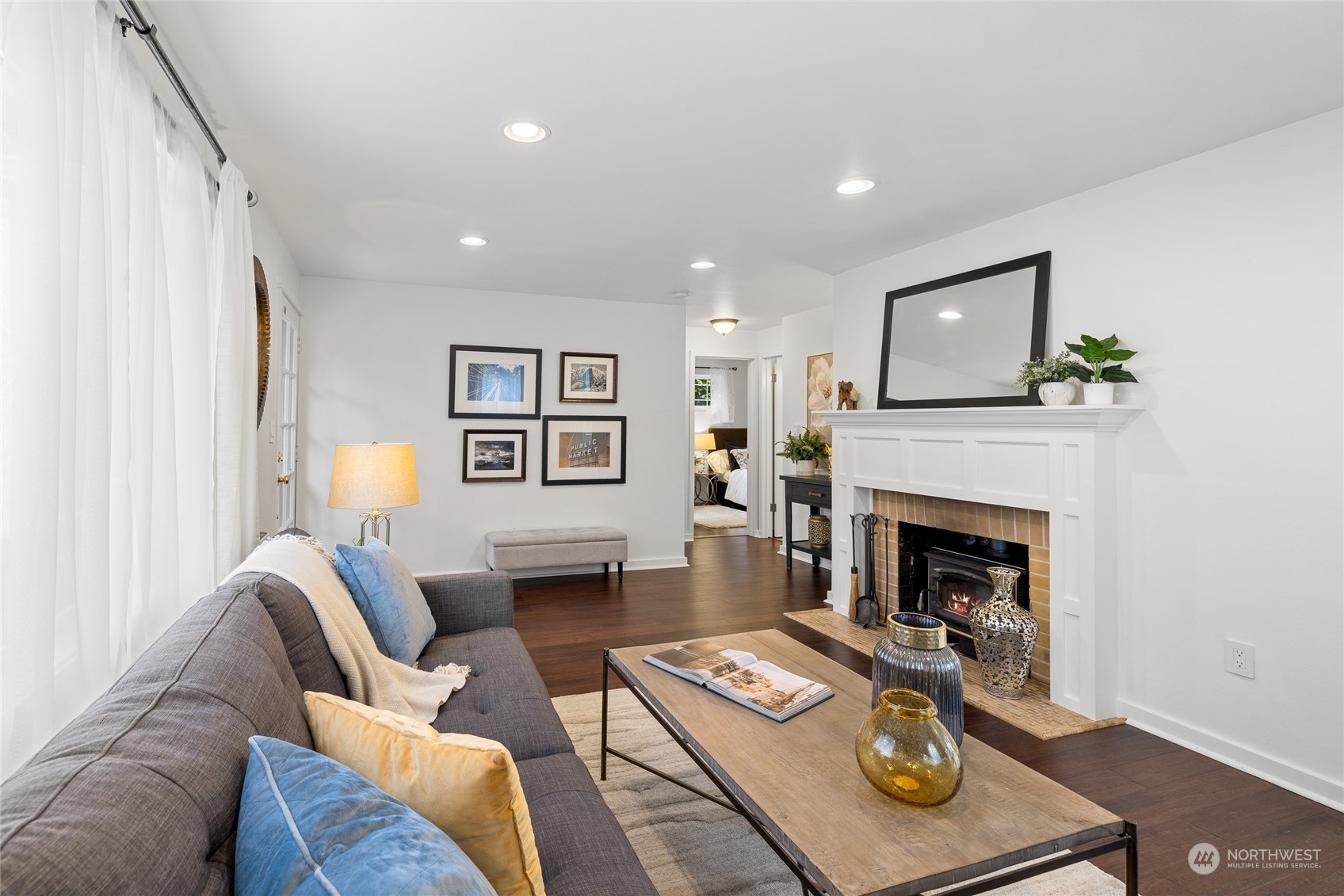 9734 31st Avenue Southwest Seattle, WA 98126 - Photo 3 of 29 a living room with furniture and a fireplace