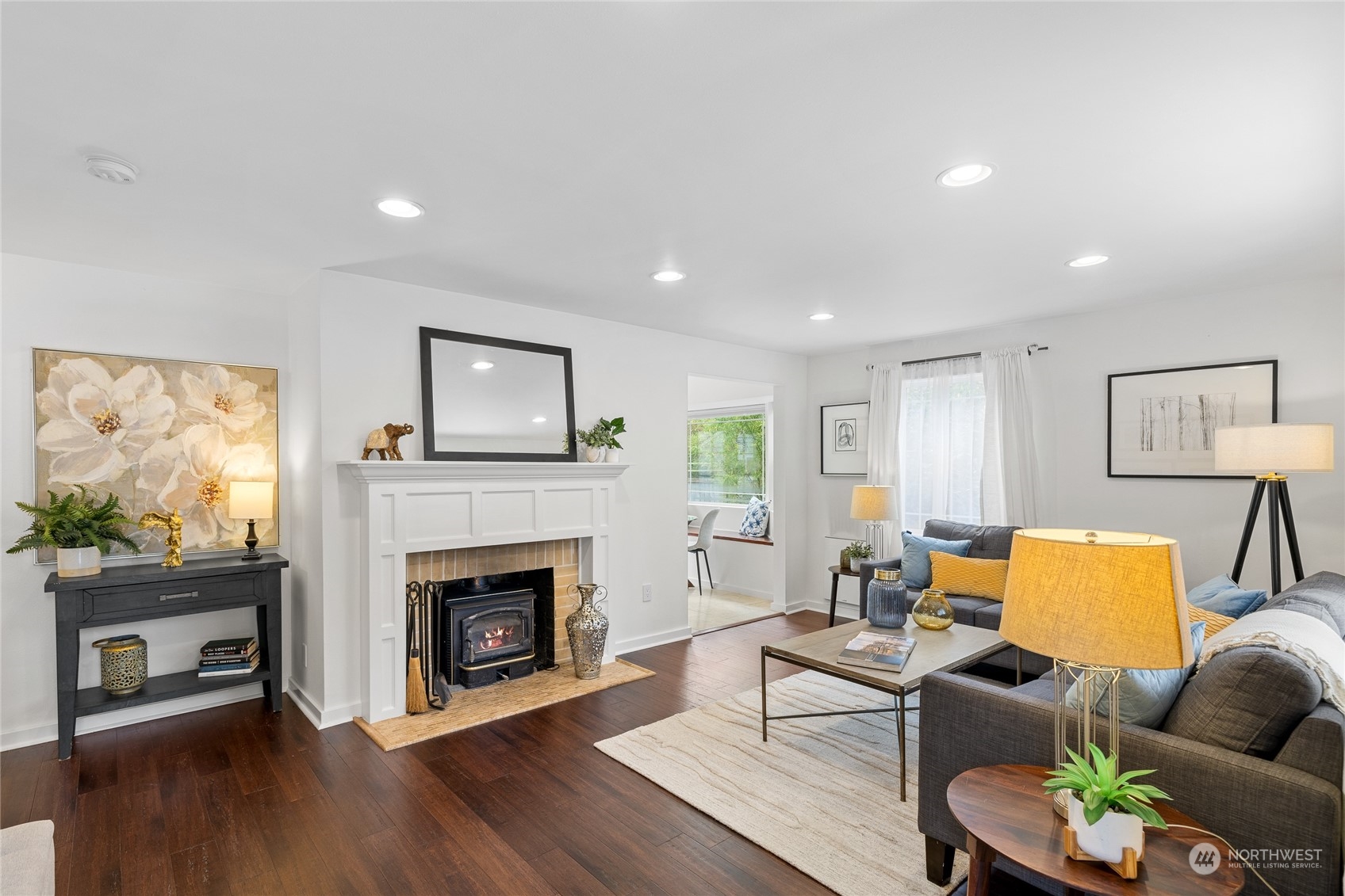 9734 31st Avenue Southwest Seattle, WA 98126 - Photo 4 of 29 a living room with furniture a fireplace and a flat screen tv