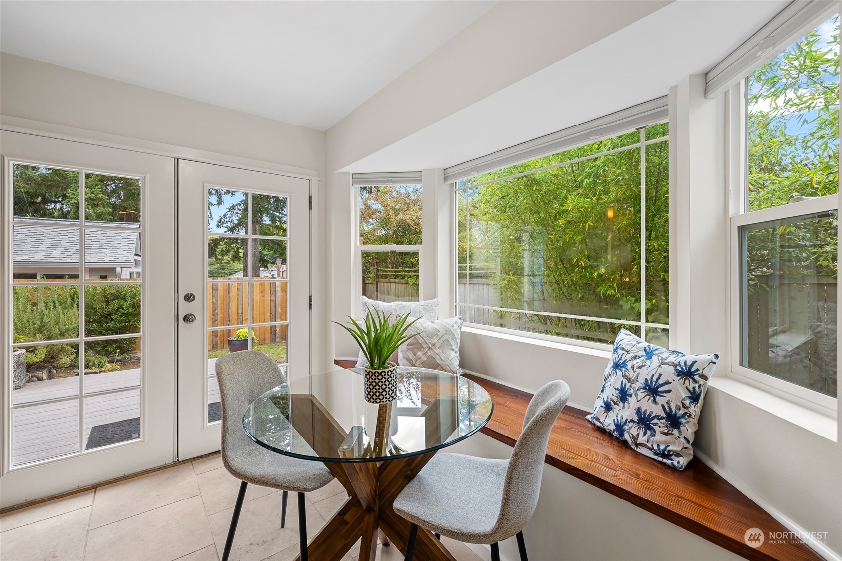 9734 31st Avenue Southwest Seattle, WA 98126 - Photo 5 of 29 a dining room with furniture and large windows