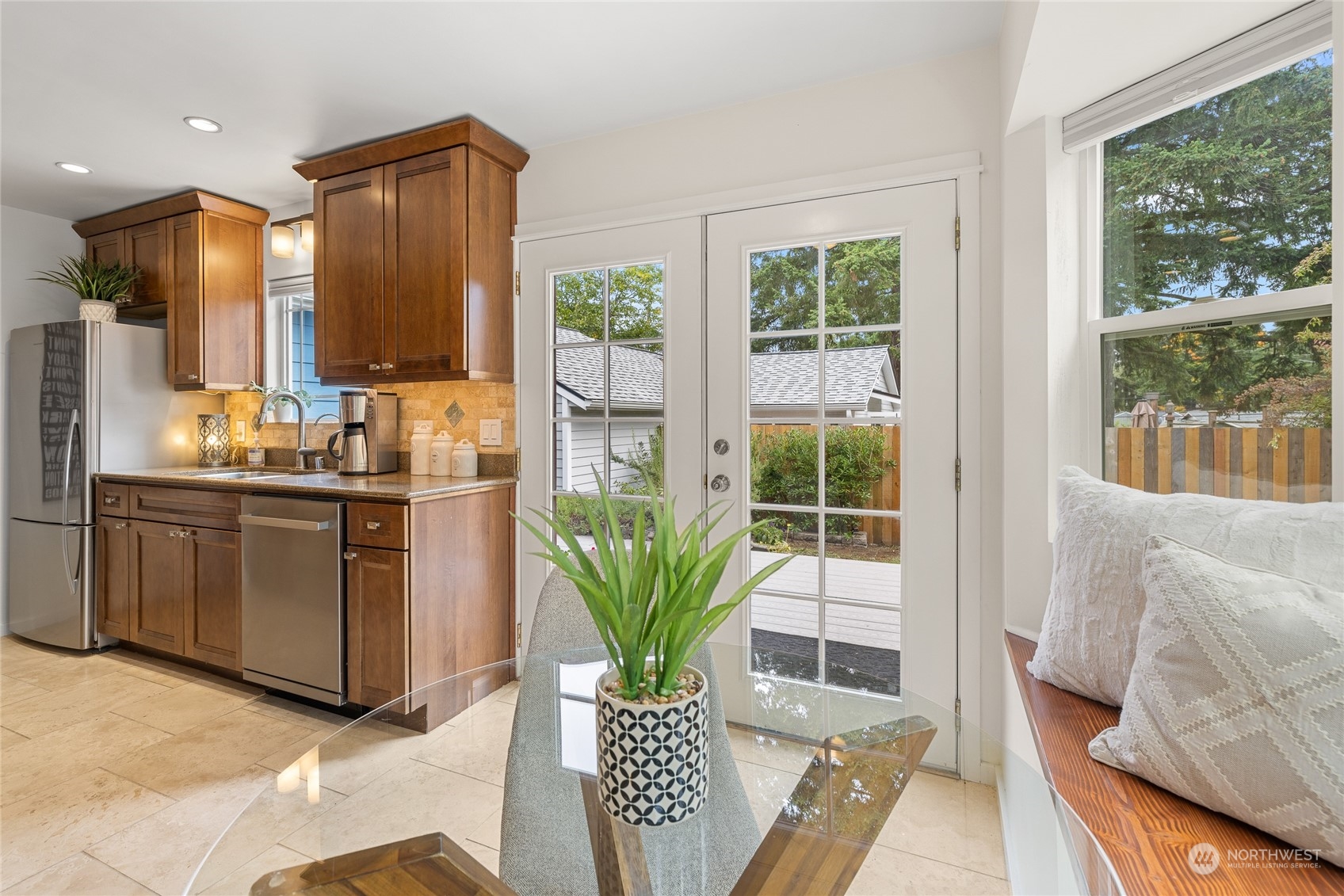 9734 31st Avenue Southwest Seattle, WA 98126 - Photo 6 of 29 a living room with stainless steel appliances furniture and a large window