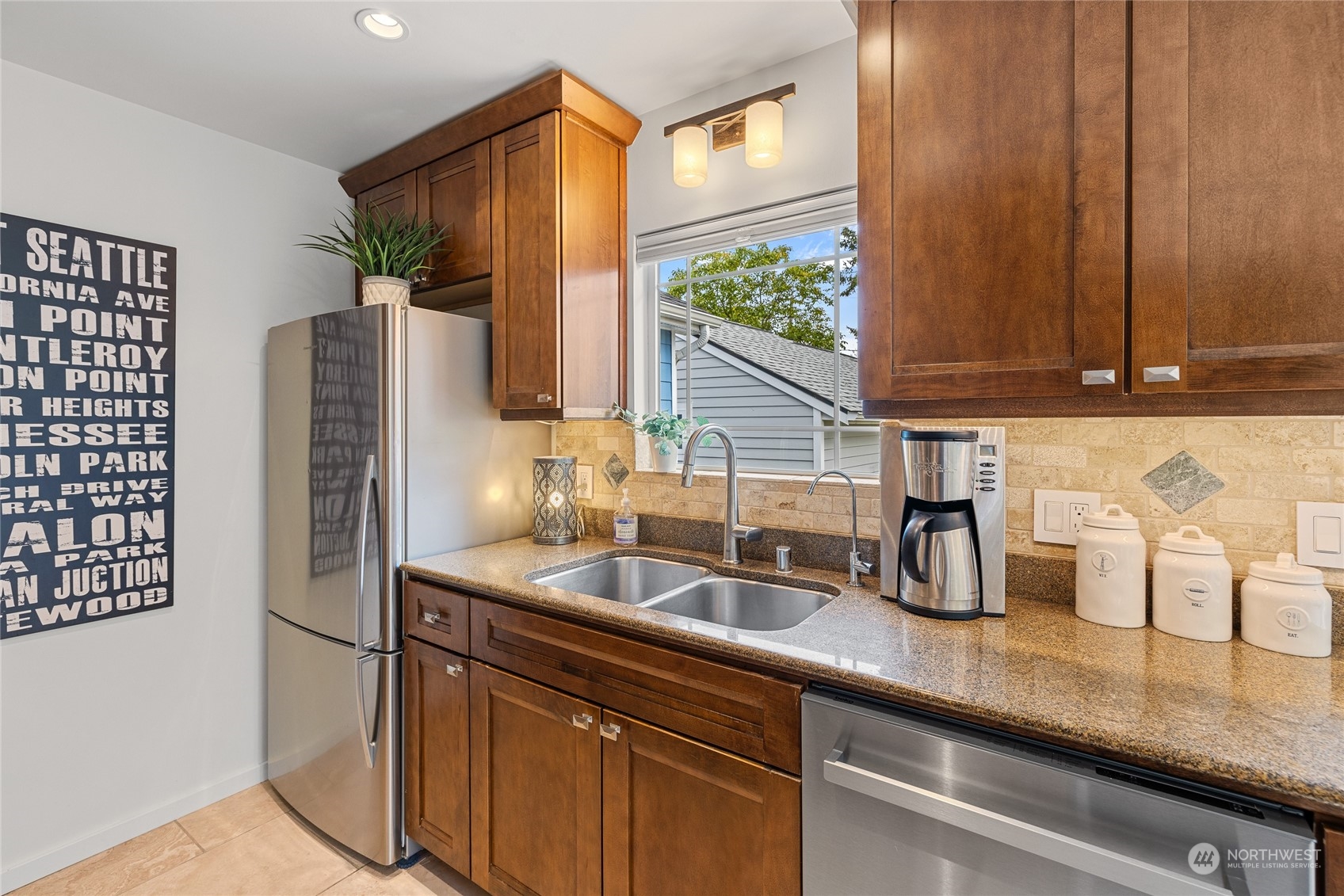 9734 31st Avenue Southwest Seattle, WA 98126 - Photo 7 of 29 a kitchen with appliances a sink and cabinets
