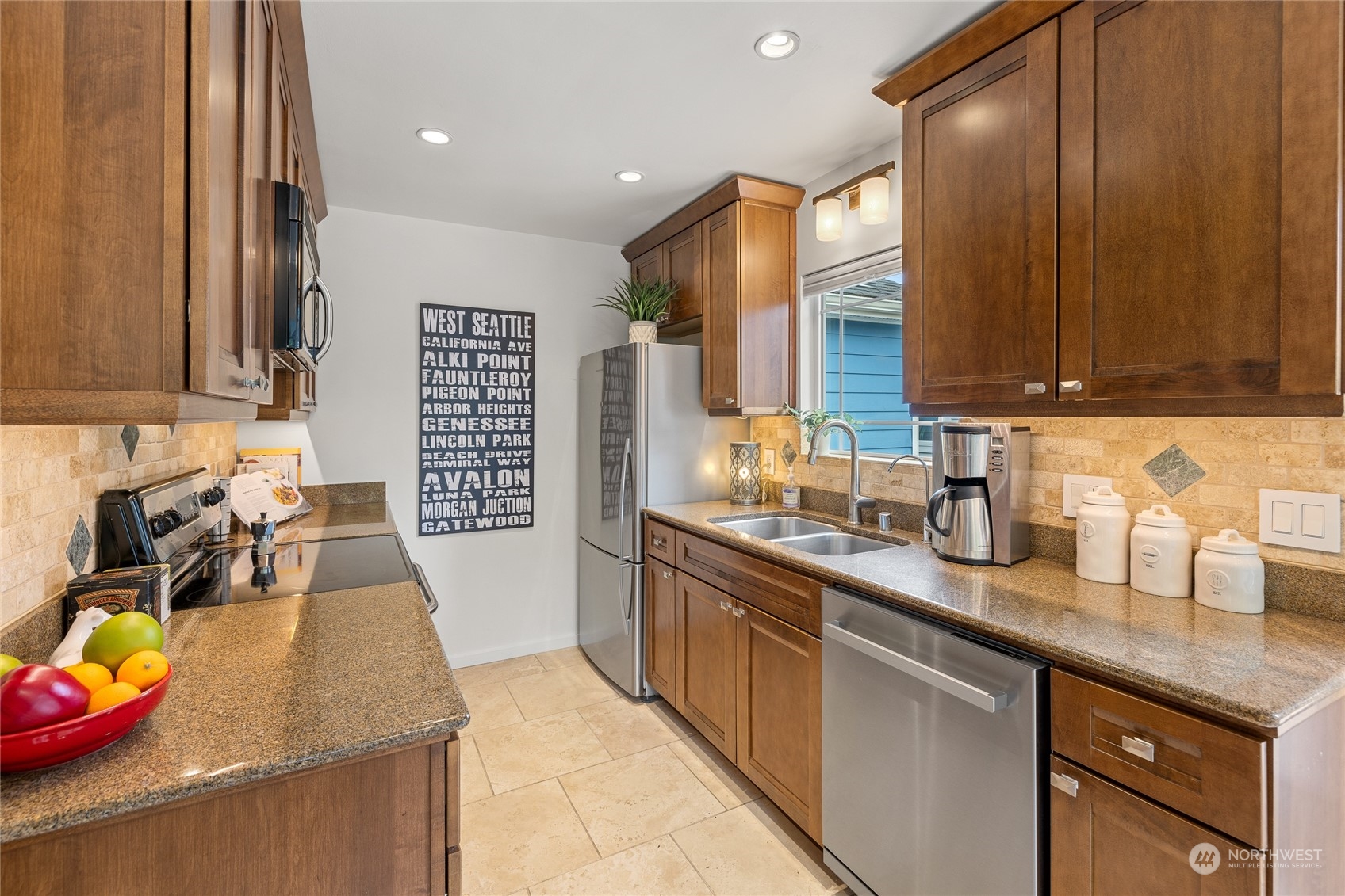 9734 31st Avenue Southwest Seattle, WA 98126 - Photo 9 of 29 a kitchen with stainless steel appliances granite countertop a sink stove and cabinets