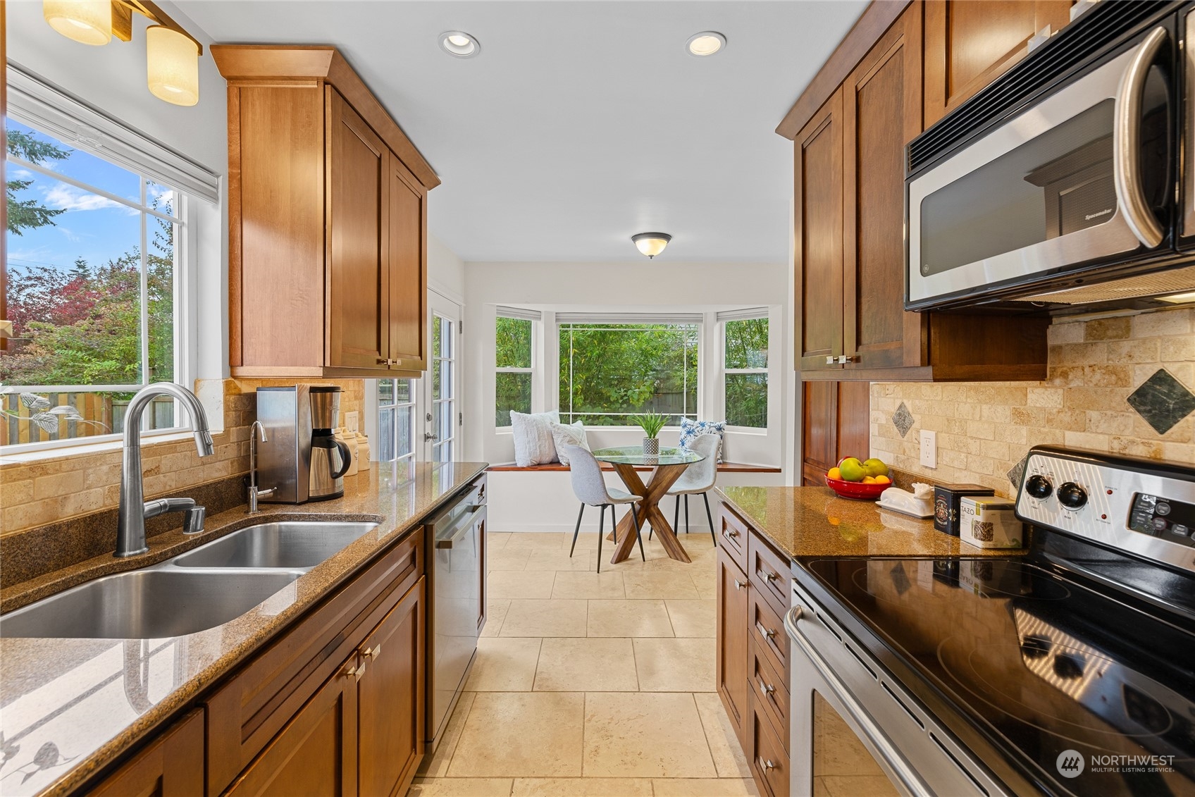 9734 31st Avenue Southwest Seattle, WA 98126 - Photo 10 of 29 a kitchen with a sink stove and cabinets