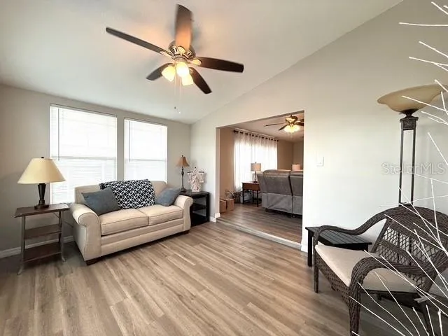 a living room with furniture and a window