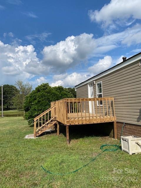 1724 Ruben Road, Unit 5 Monroe, NC 28112 - Photo 2 of 13 a view of a house with a backyard and a chair