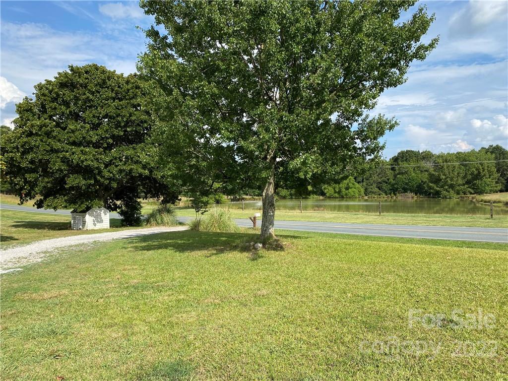 1724 Ruben Road, Unit 5 Monroe, NC 28112 - Photo 5 of 13 a view of pool and trees in the background