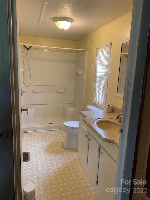 1724 Ruben Road, Unit 5 Monroe, NC 28112 - Photo 10 of 13 a bathroom with a sink a toilet and shower