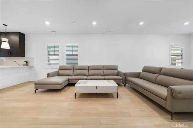 a large kitchen with stainless steel appliances kitchen island a large island in the center