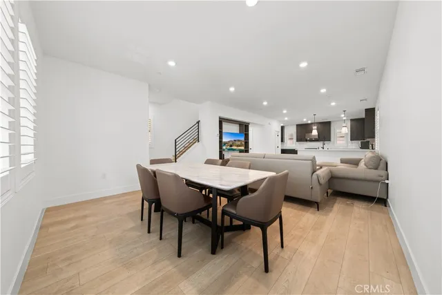 a view of a dining room with furniture and window
