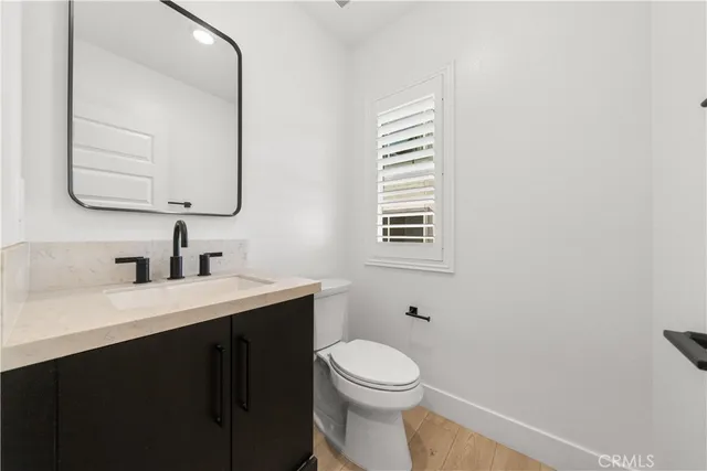 a living room with furniture and a stairs