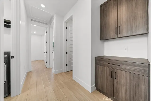 a view of entryway with wooden floor