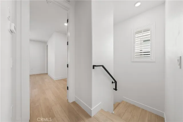 a room with a bed and window