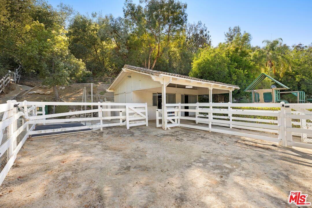25217 Eldorado Meadow Road Hidden Hills, CA 91302 - Photo 17 of 26 a view of a house with backyard and trees