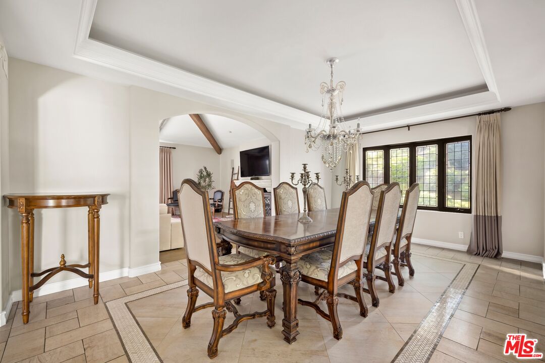 25217 Eldorado Meadow Road Hidden Hills, CA 91302 - Photo 5 of 26 a view of a dining room with furniture window and outside view