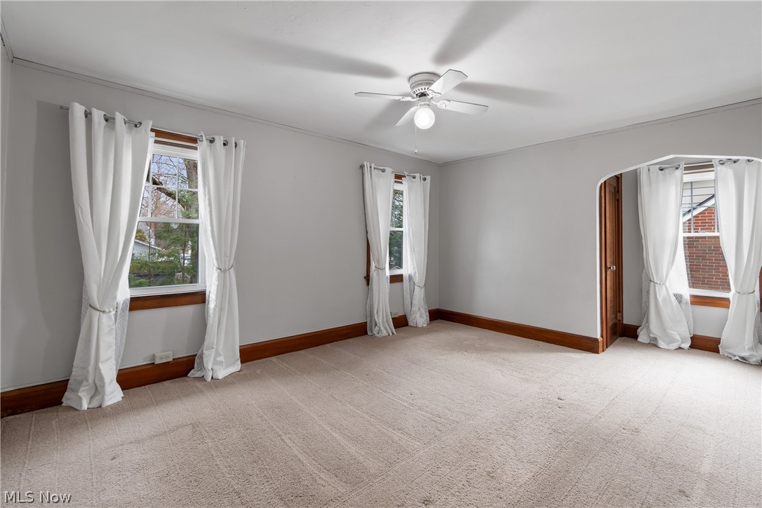2214 Cleveland Road Wooster, OH 44691 - Photo 21 of 38 Bedroom #3 - This bedroom is very well lit with several windows and far to the rear you can see the door leading to the walkin closet which extends all the way back to the wall on the left.