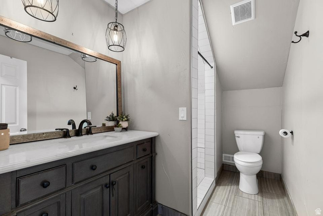 225 Falcon Court Ivins, UT 84738 - Photo 23 of 47 Bathroom featuring vanity and vaulted ceiling