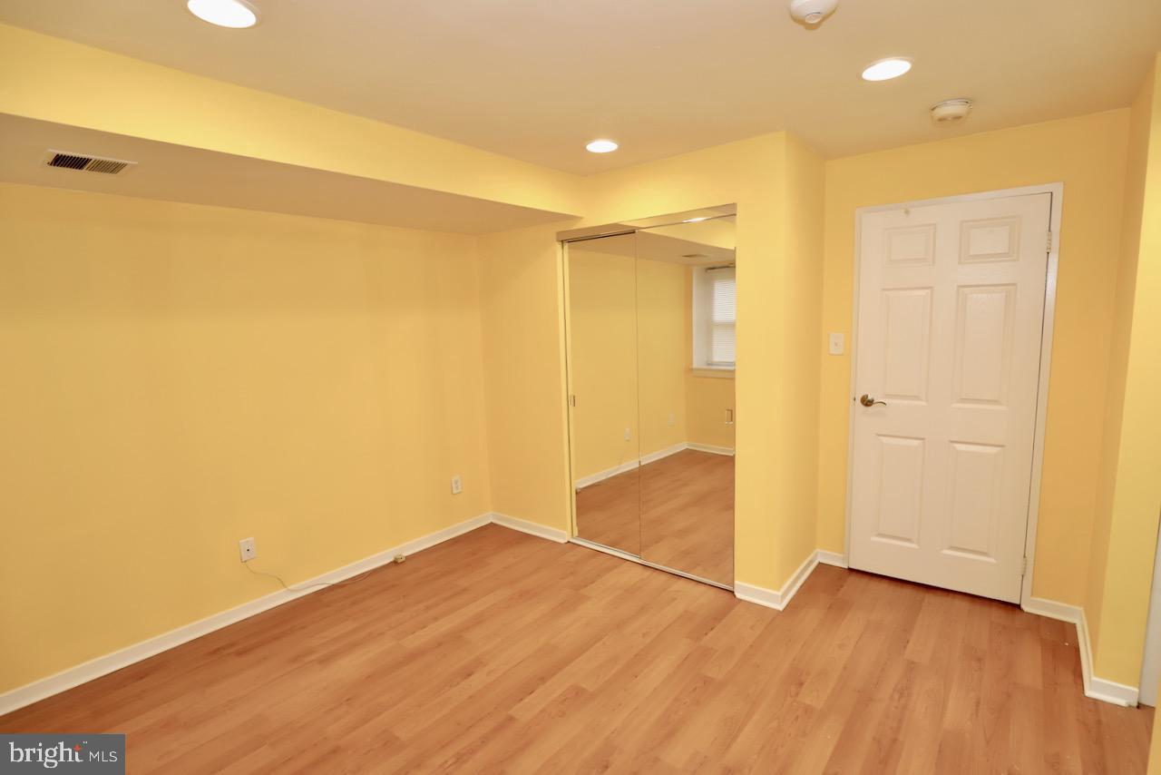 1737 Wallace Street, Unit 101 Philadelphia, PA 19130 - Photo 13 of 15 a view of empty room with wooden floor