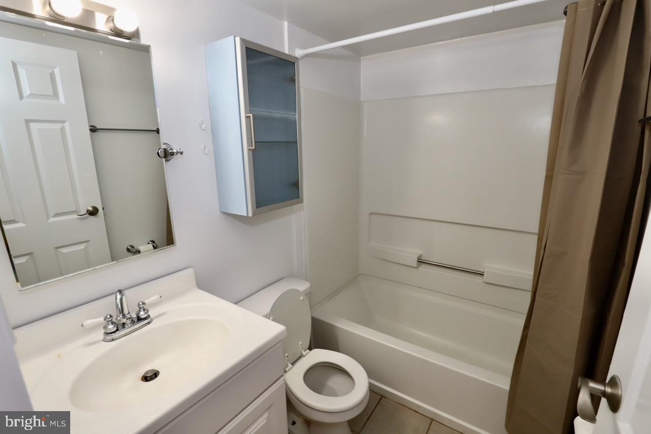 1737 Wallace Street, Unit 101 Philadelphia, PA 19130 - Photo 15 of 15 a bathroom with a sink toilet and shower