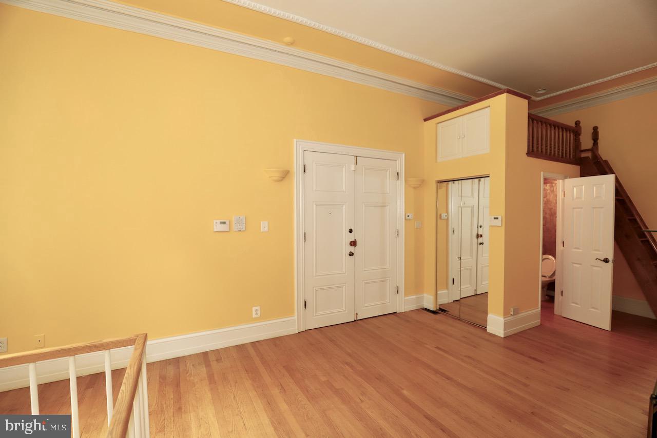 1737 Wallace Street, Unit 101 Philadelphia, PA 19130 - Photo 4 of 15 a view of empty room with wooden floor