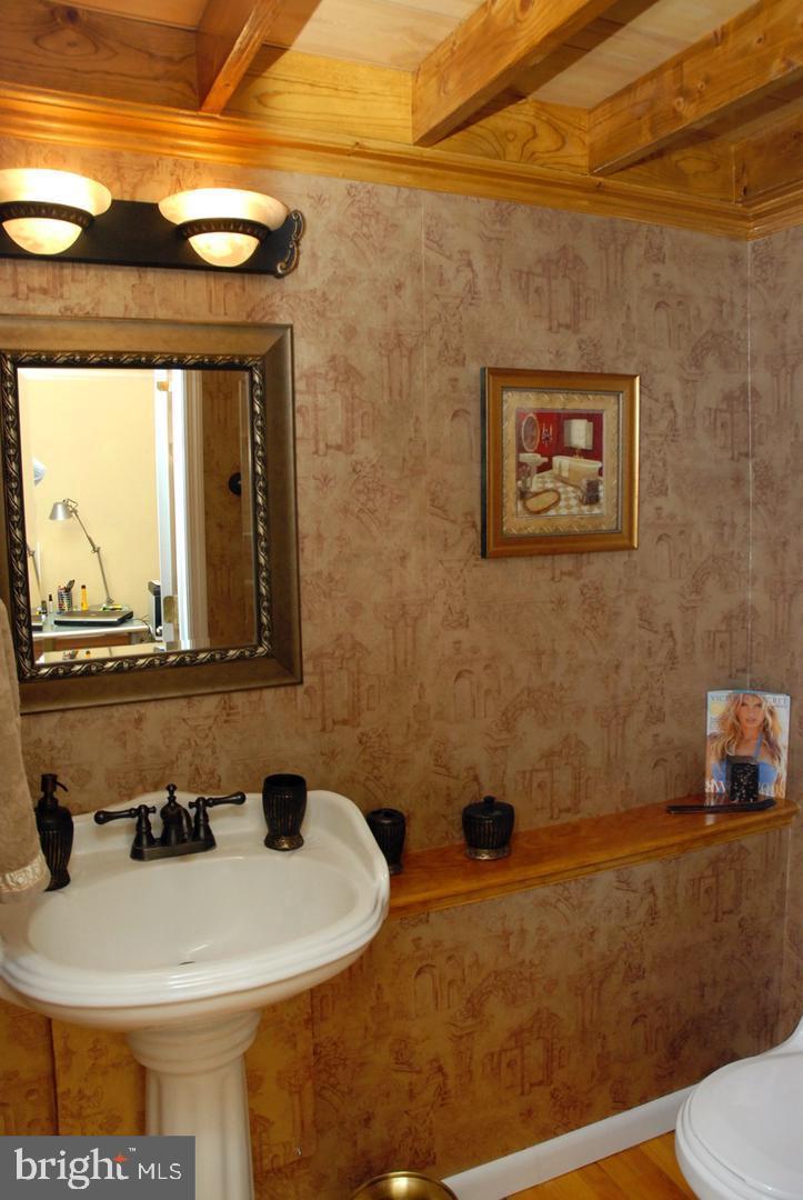 1737 Wallace Street, Unit 101 Philadelphia, PA 19130 - Photo 7 of 15 a bathroom with a sink and a toilet