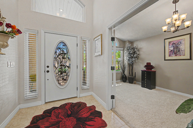 3034 Swiss Drive Santa Clara, UT 84765 - Photo 25 of 59 Entryway with a decorative oval glass door, sidelight windows, and an arched transom window