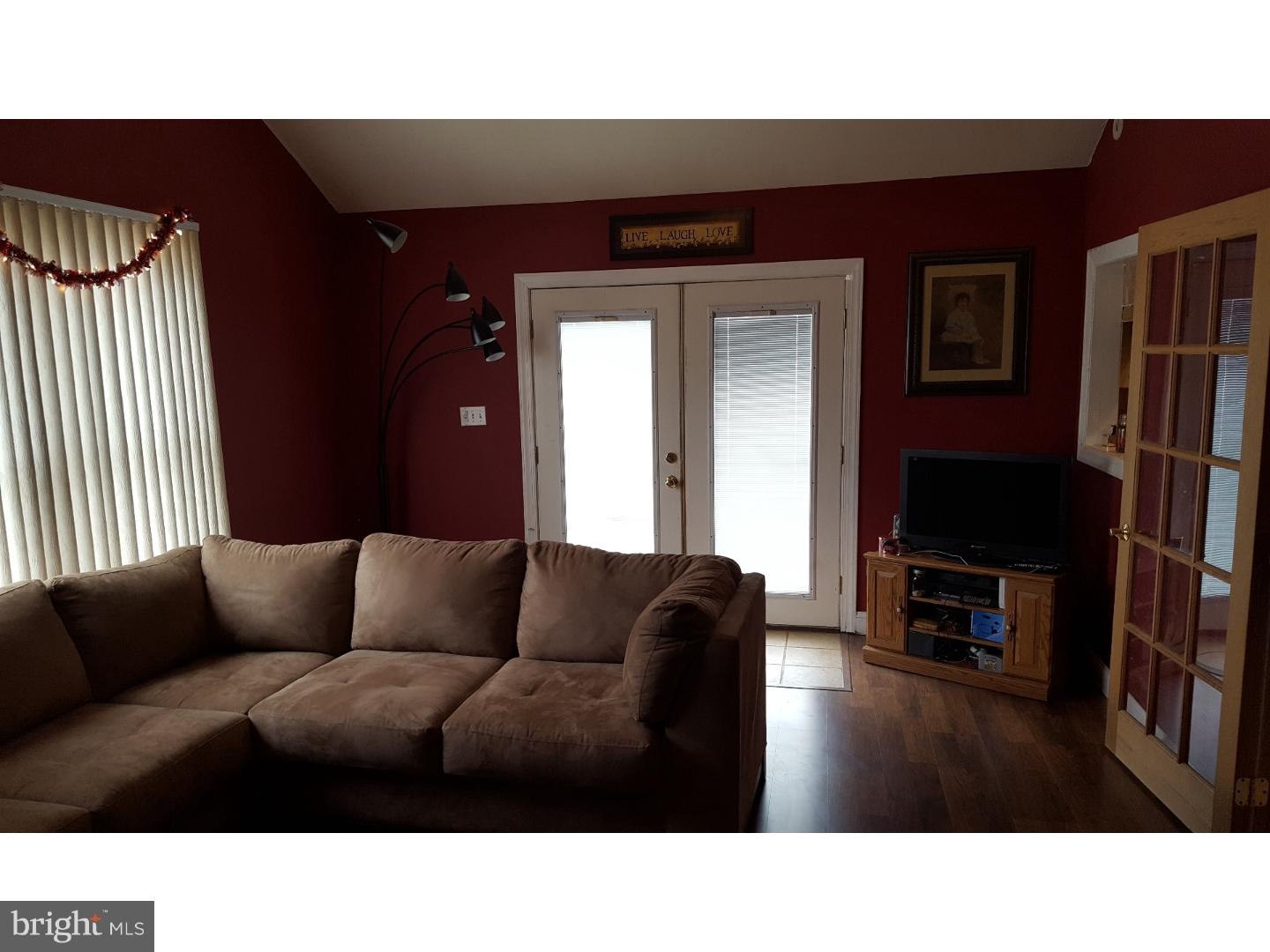 7 Calicobush Road Levittown, PA 19057 - Photo 8 of 25 a living room with furniture and a flat screen tv