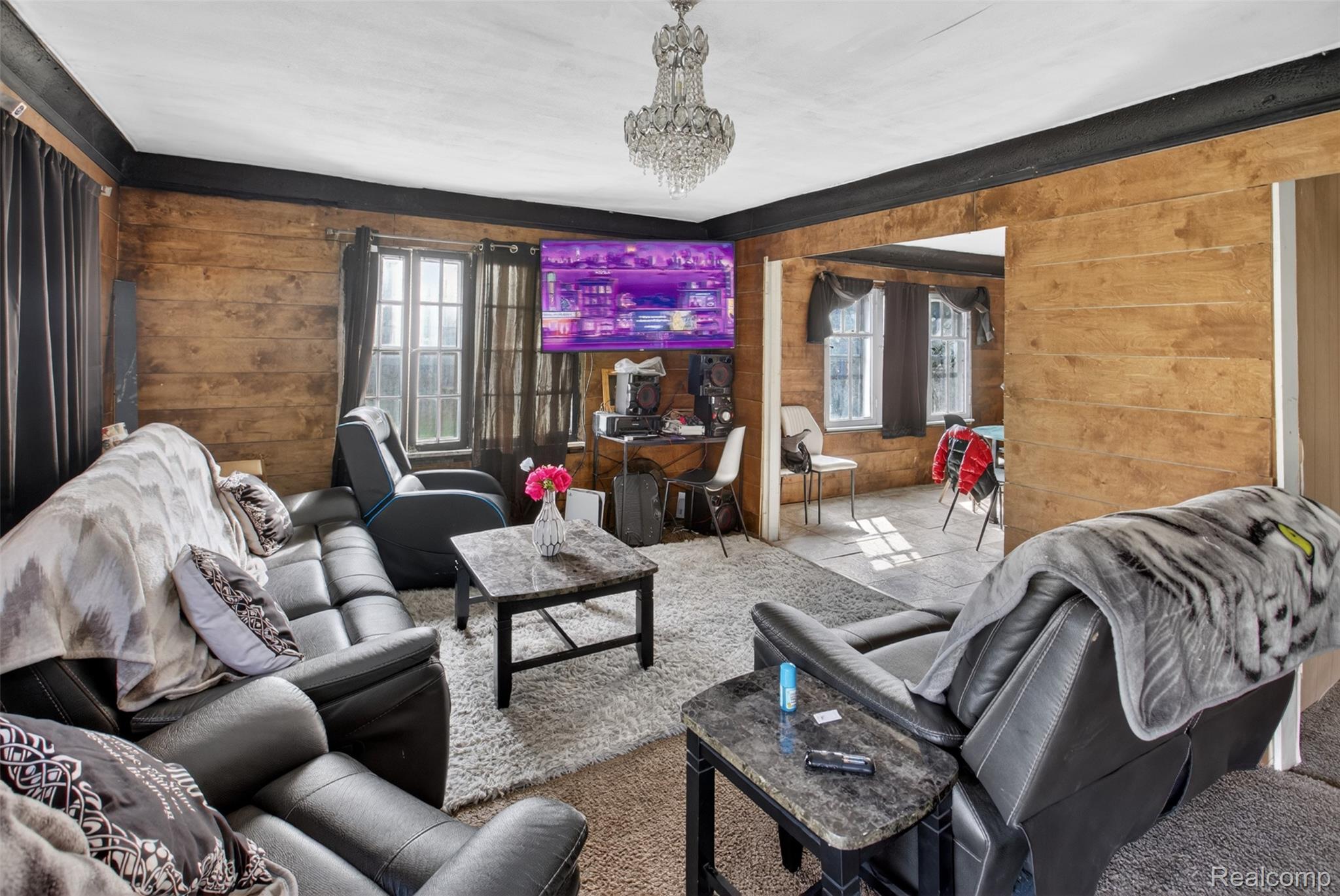 454 East Atherton Road Flint, MI 48507 - Photo 5 of 24 Living room featuring wooden walls