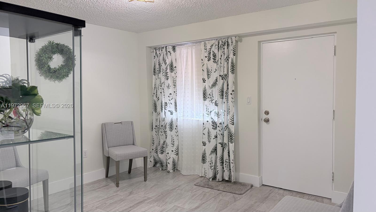 199 Southwest 12th Avenue, Unit 415B Miami, FL 33130 - Photo 12 of 39 a view of room with wooden floor and closet