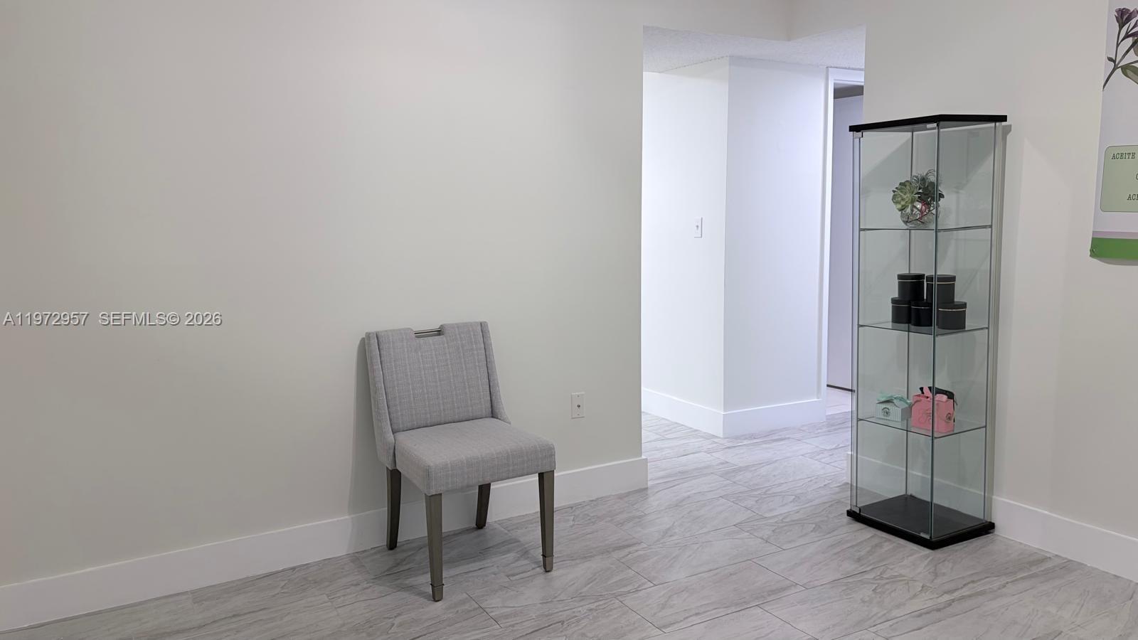 199 Southwest 12th Avenue, Unit 415B Miami, FL 33130 - Photo 13 of 39 a view of room with wooden floor and furniture