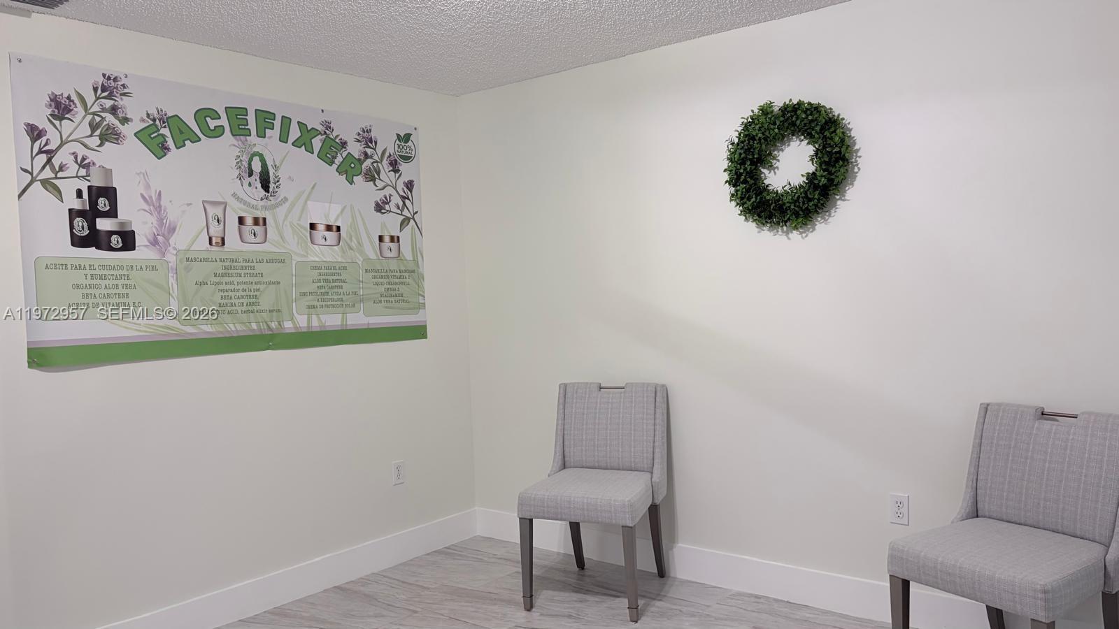 199 Southwest 12th Avenue, Unit 415B Miami, FL 33130 - Photo 14 of 39 a bathroom with a toilet and a painting on the wall