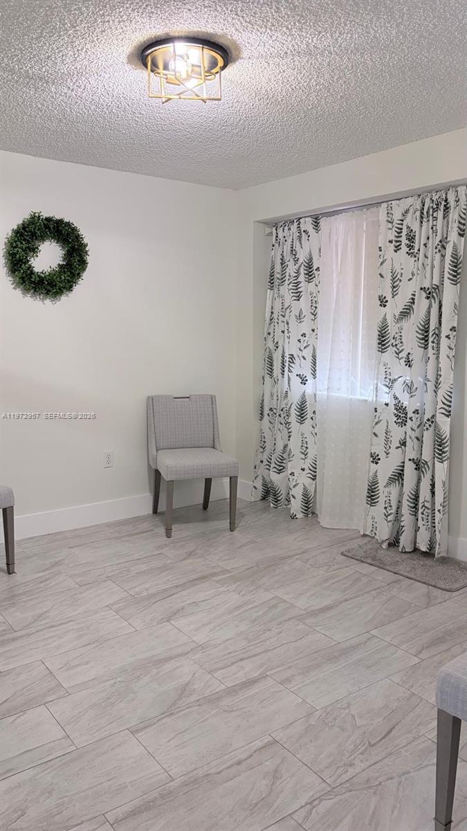199 Southwest 12th Avenue, Unit 415B Miami, FL 33130 - Photo 15 of 39 a living room with furniture and a large window