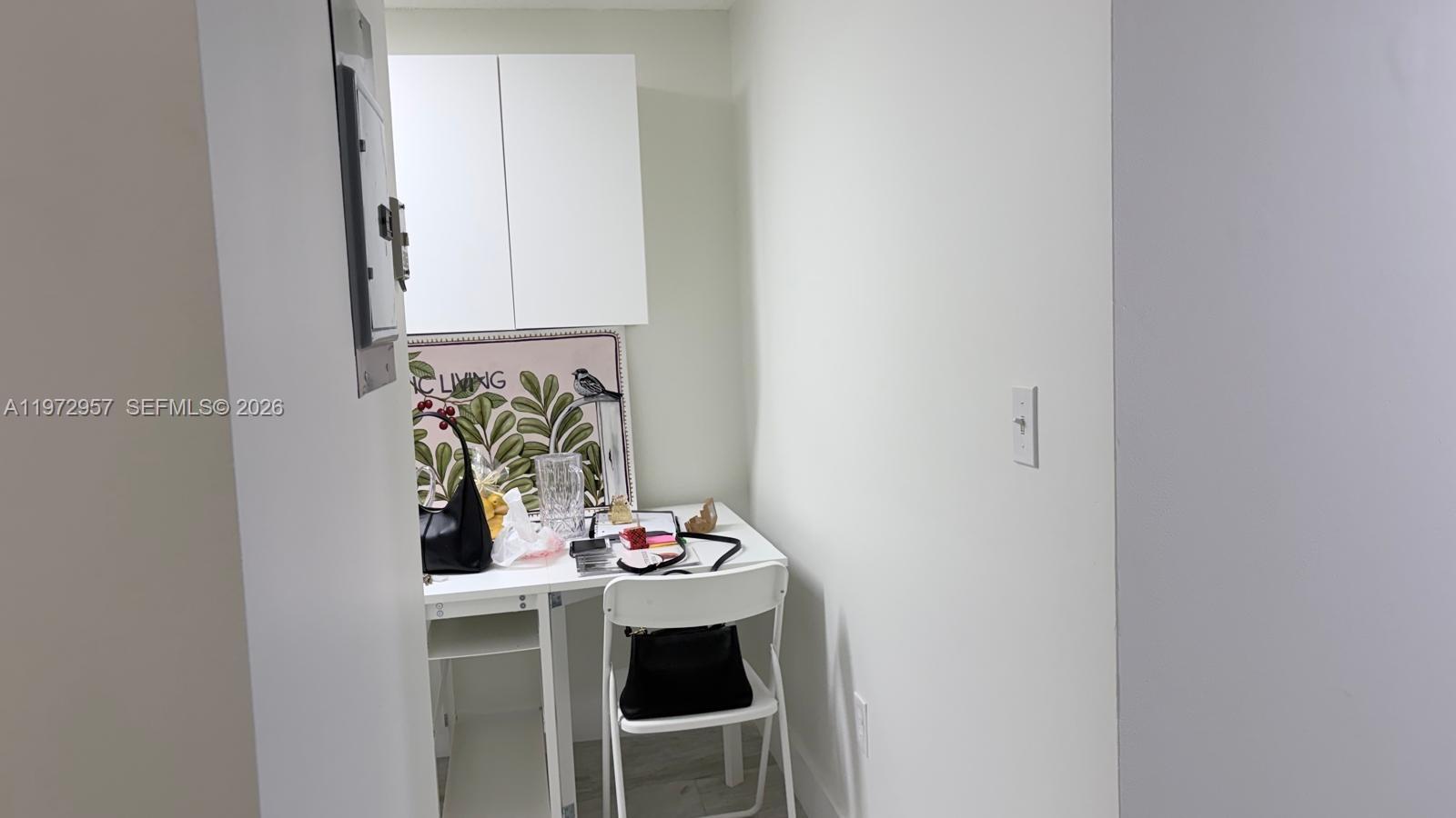 199 Southwest 12th Avenue, Unit 415B Miami, FL 33130 - Photo 16 of 39 a table and chairs in a kitchen