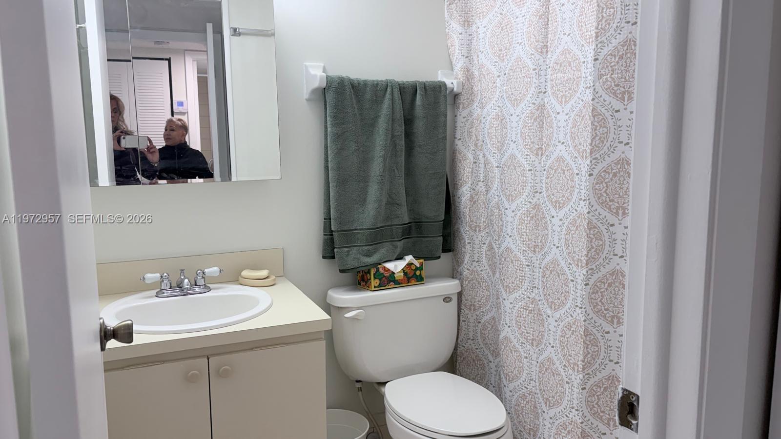 199 Southwest 12th Avenue, Unit 415B Miami, FL 33130 - Photo 29 of 39 a bathroom with a sink toilet and shower