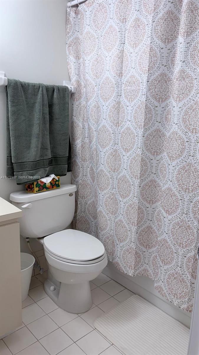 199 Southwest 12th Avenue, Unit 415B Miami, FL 33130 - Photo 30 of 39 a bathroom with a toilet and a shower