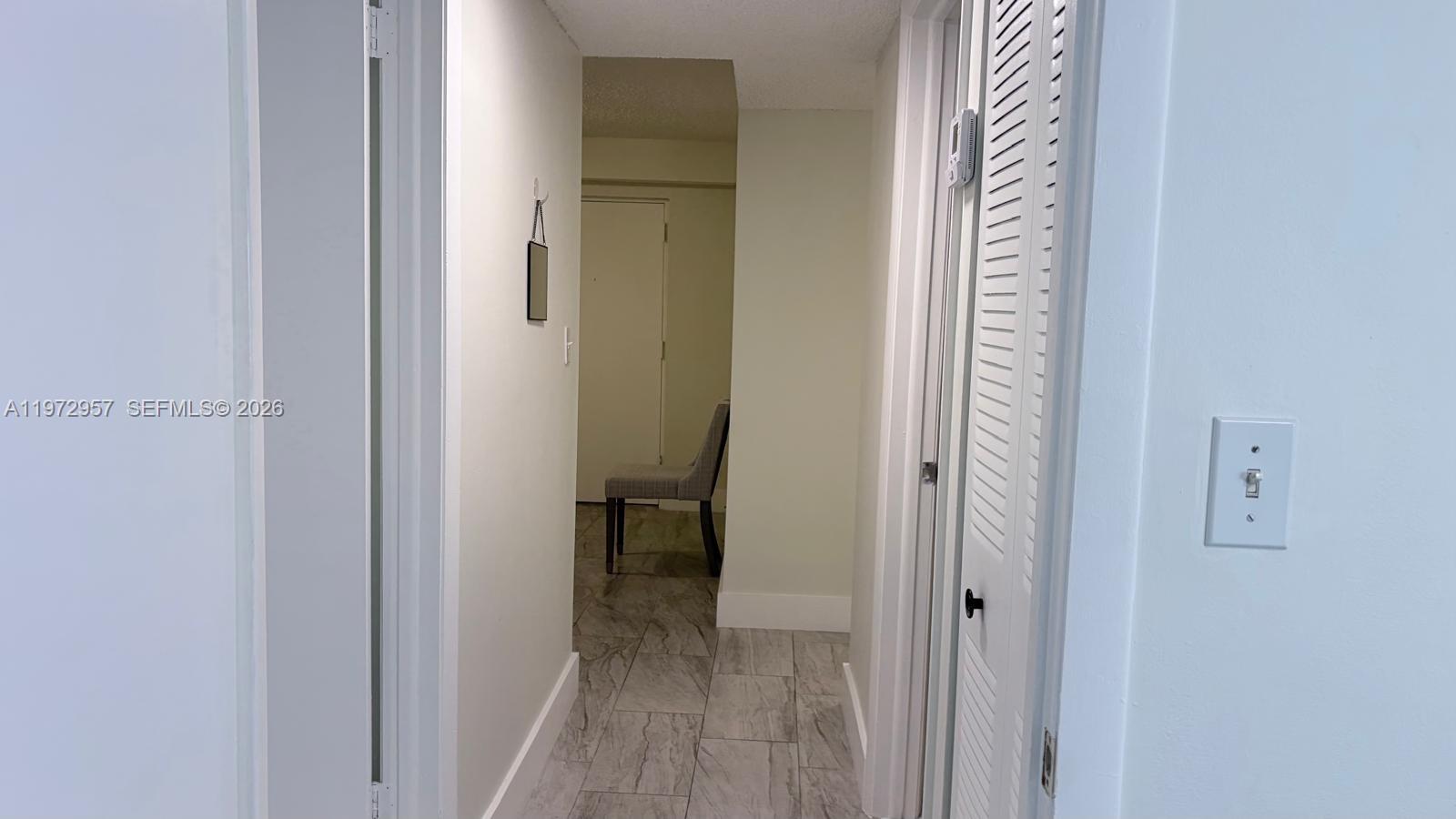 199 Southwest 12th Avenue, Unit 415B Miami, FL 33130 - Photo 32 of 39 a view of a bathroom from a hallway