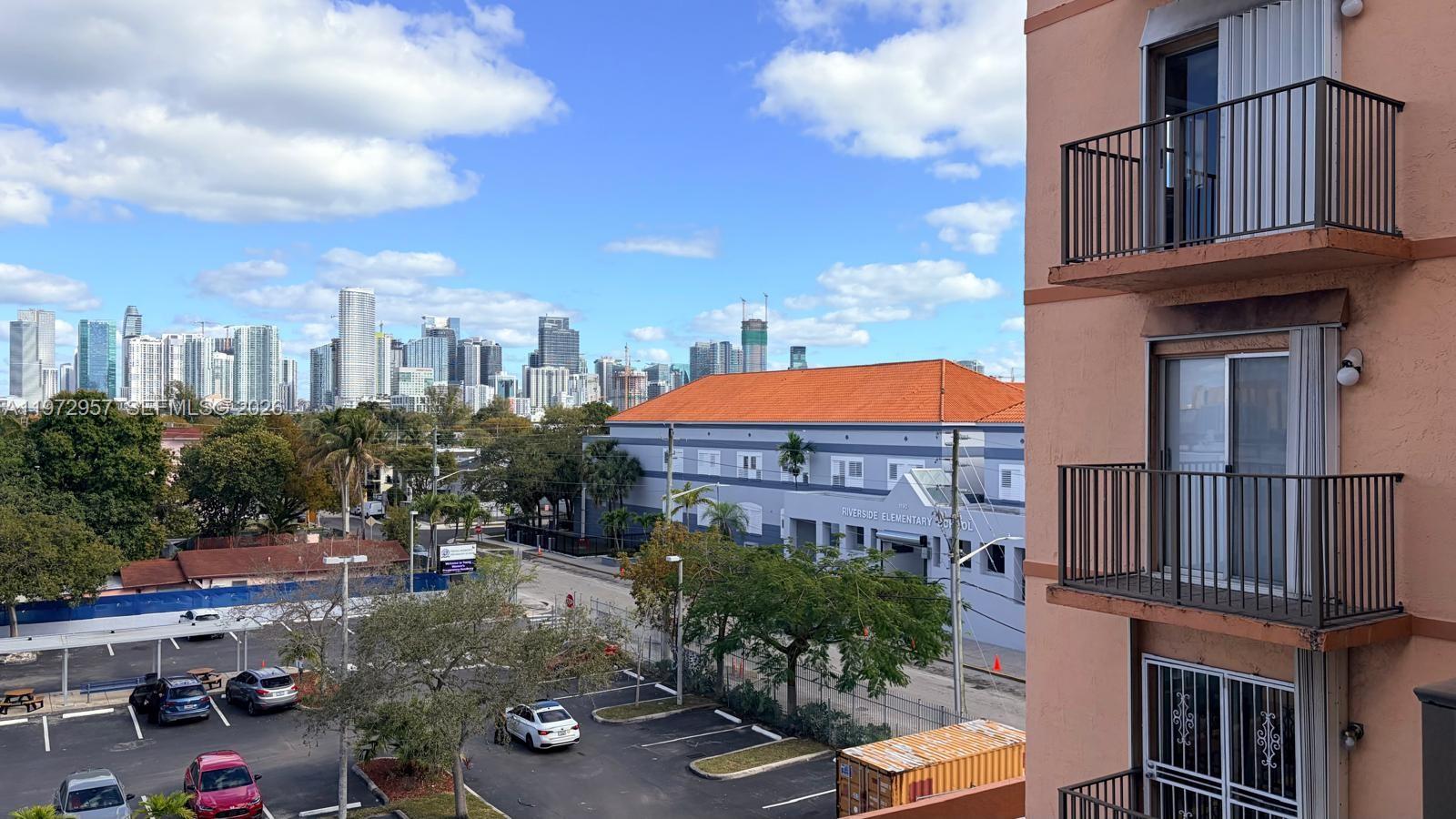 199 Southwest 12th Avenue, Unit 415B Miami, FL 33130 - Photo 35 of 39 a front view of a building with garden