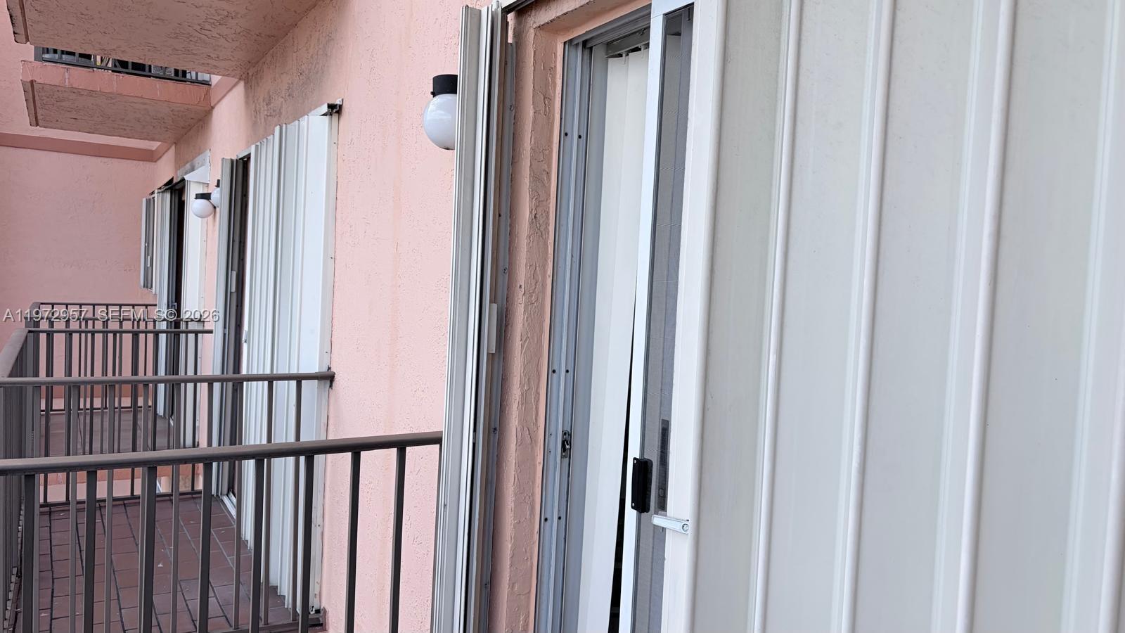 199 Southwest 12th Avenue, Unit 415B Miami, FL 33130 - Photo 39 of 39 a view of a porch with a door