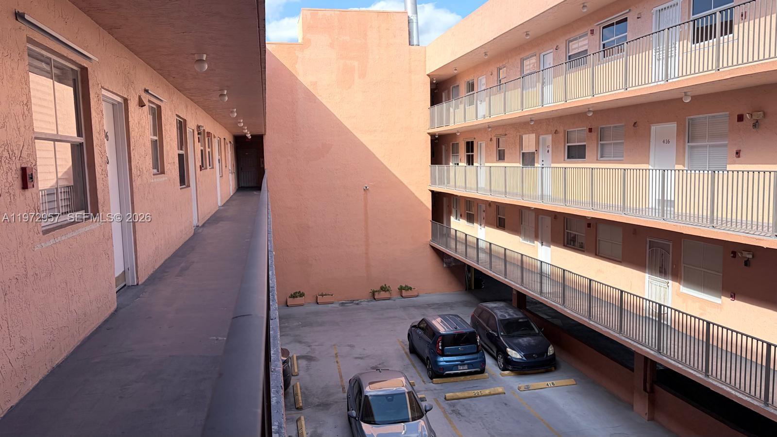 199 Southwest 12th Avenue, Unit 415B Miami, FL 33130 - Photo 9 of 39 a view of a balcony with chairs and stairs