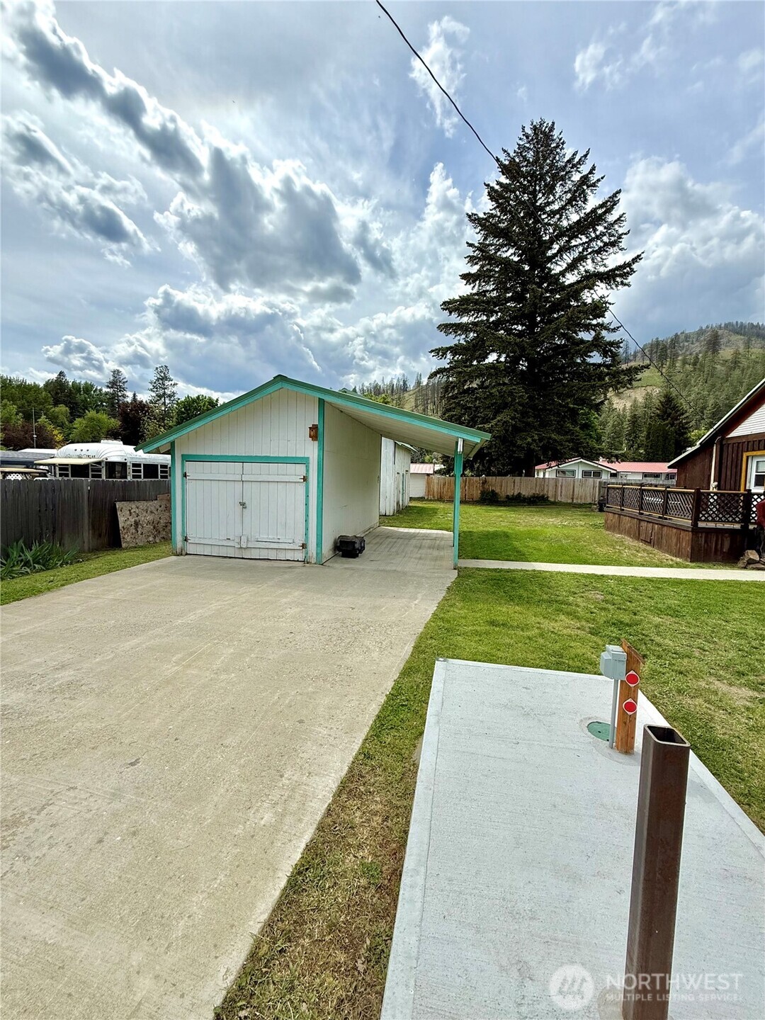 119 North Main Street Conconully, WA 98819 - Photo 11 of 30 a view of a house with a yard