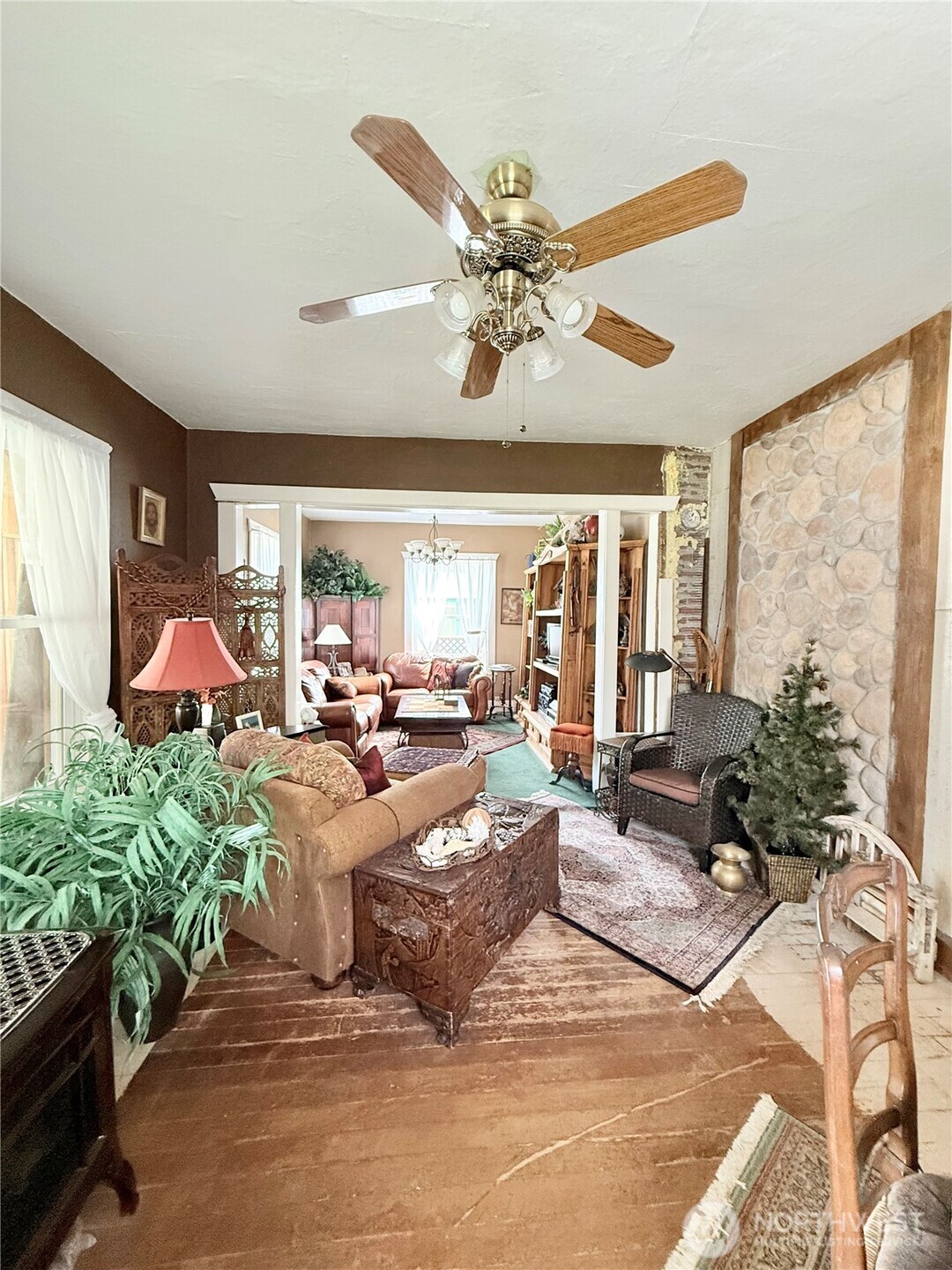 119 North Main Street Conconully, WA 98819 - Photo 13 of 30 a living room with patio furniture and a large window