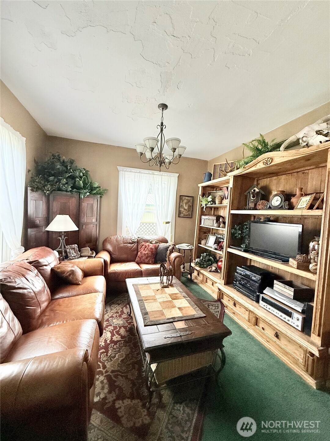 119 North Main Street Conconully, WA 98819 - Photo 18 of 30 a living room with furniture and a flat screen tv