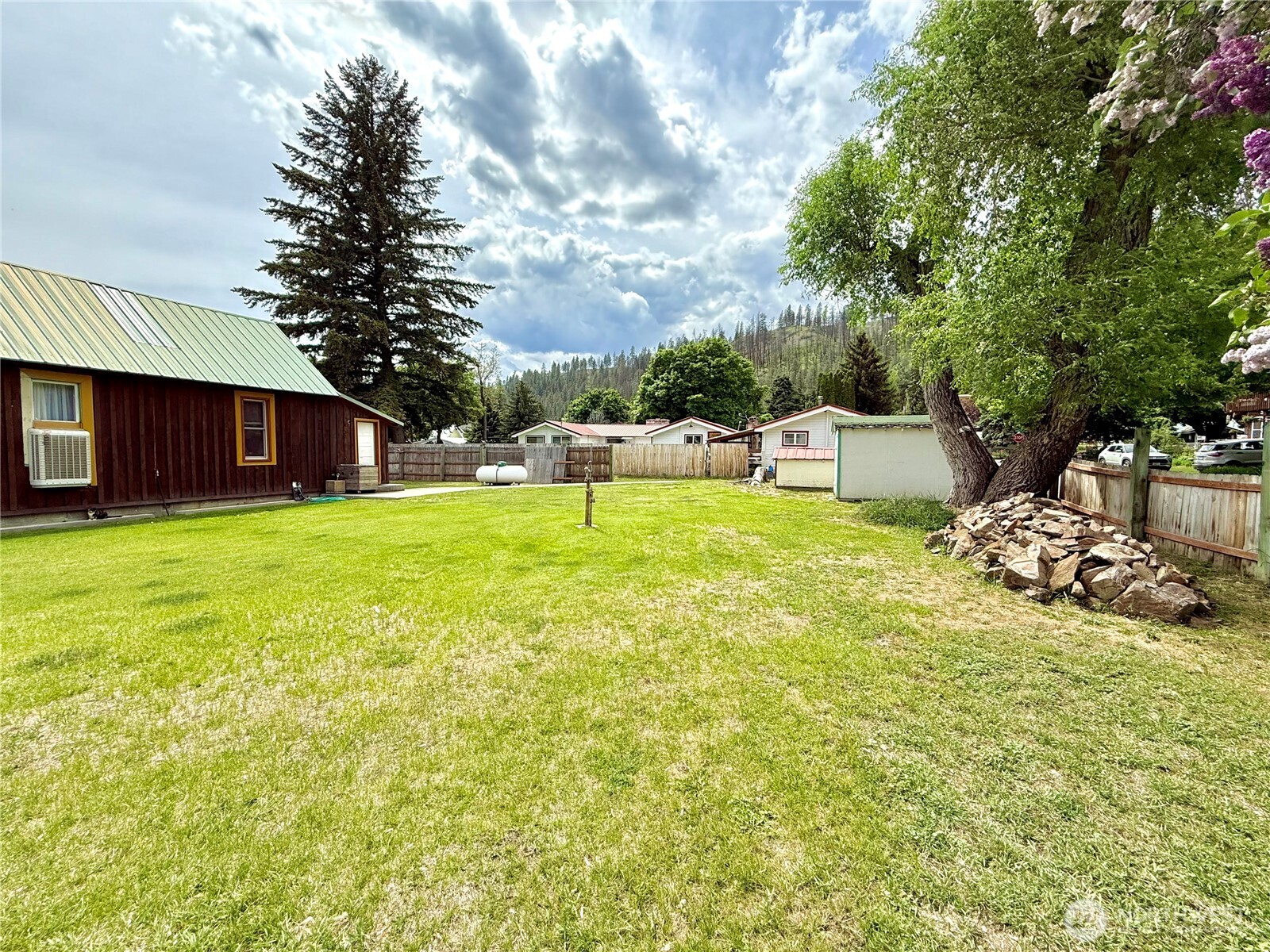 119 North Main Street Conconully, WA 98819 - Photo 8 of 30 a view of a house with a yard and sitting area