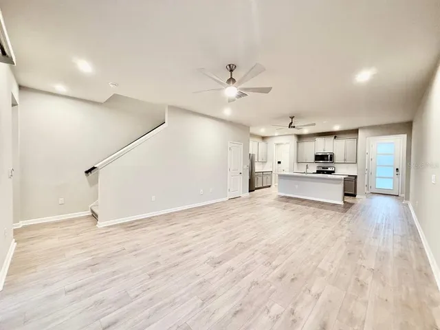a view of kitchen with wooden floor and window