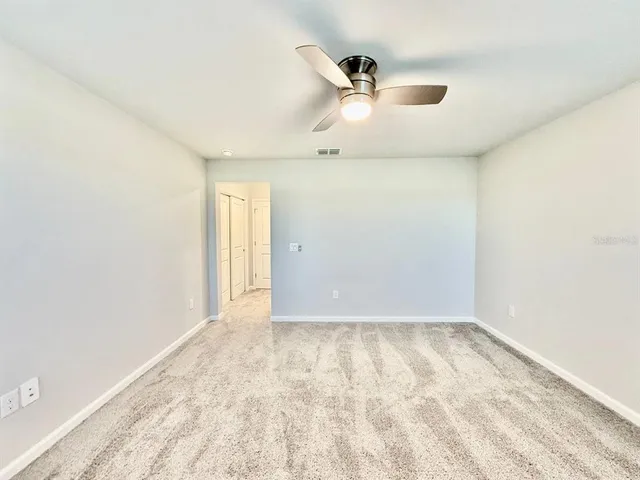 an empty room with a empty space and a window