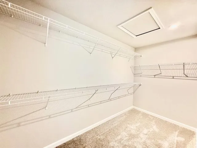 a bathroom with double sink and a mirror