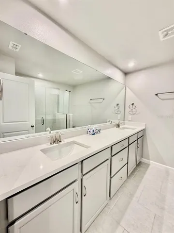 a bathroom with a shower and a tub