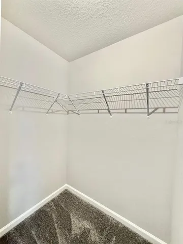 a bathroom with a sink a toilet and a large mirror